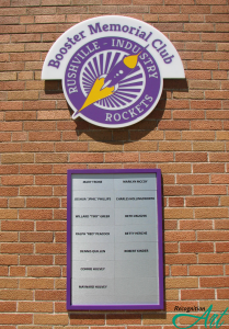A metal, magnet and acrylic donor recognition display by RecognitionArt for Rushville-Industry High School in purple, yellow, and silver with a rocket icon and the names of those who donated money through their memorial.
