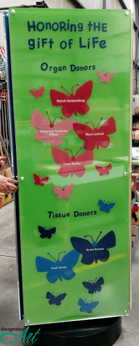 Freestanding rotating donor displays for the University of Chicago Hospital and Gift of Hope. This three sided rotating display is themed with butterflies and recognizing those who gave the ultimate sacrifice in donating organs and tissue. The panel is in green it shows the names of children and adults in butterflies who gave someone life.